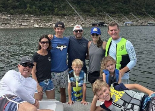 Family with kids in life jackets on a Lake Travis charter