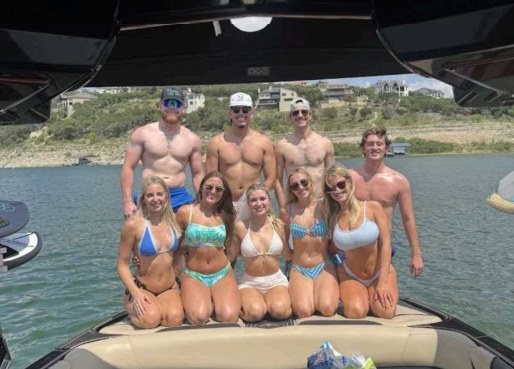 Group celebrating a bachelor and bachelorette trip on the boat